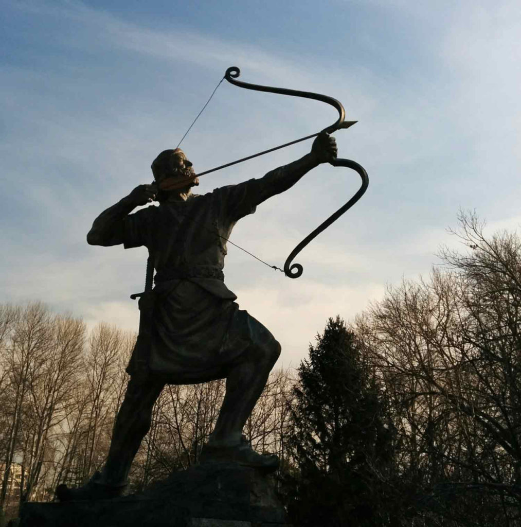 Man shooting a bow